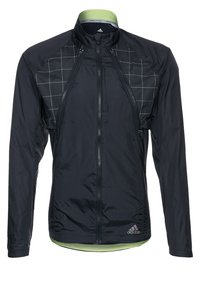 Chaqueta de running ligera y negra con un patrón de cuadrícula en la parte frontal superior, cierre de cremallera completo y detalles en verde en el cuello y el dobladillo.