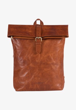 Brown leather backpack with a roll-top design, featuring a metal buckle, zipper closure, and textured surface. Simple branding on the front.