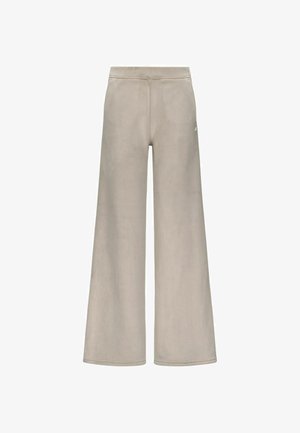 Pantalons de survêtement larges beige clair avec une finition texturée, dotés d'une taille haute et d'un logo discret à l'arrière.