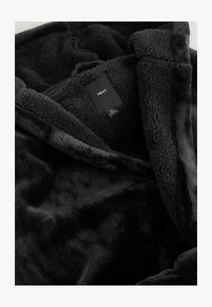 Must mustest kootud pehme fliisimaterjalist, millel on suur kapuuts, avatud esikülg ja silt "NEXT" brändinguga.