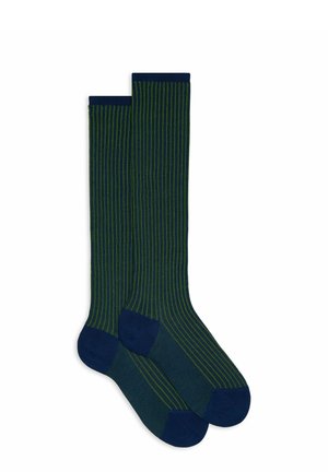 Calze al ginocchio di colore verde scuro con strisce blu navy. Tessuto a coste, tallone e punta rinforzati in blu navy solido. Fascetta elastica liscia sulla parte superiore.