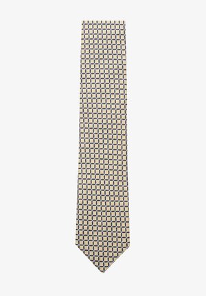 Beige tie featuring a geometric pattern with navy accents, made of textured fabric, with a classic narrow shape and pointed tip.
