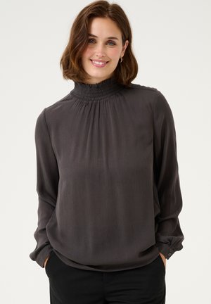 Dark gray blouse with a high smocked collar, long sleeves, and a loose fit. Made from lightweight, slightly textured fabric.