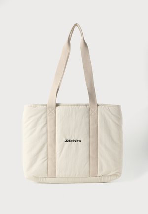 Cream-colored tote bag with long beige handles and "Dickies" logo embroidered in black on front center.