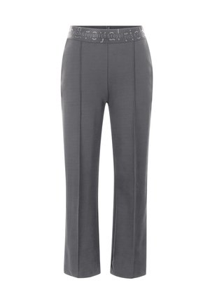 Pantalon gris avec une large taille élastique comportant du texte. Design à jambe droite avec des détails de couture sur le devant. Fabriqué en tissu doux.