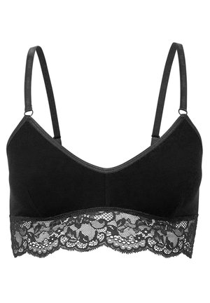 Bralette noir avec bretelles ajustables, en coton doux, et une bordure en dentelle au bas présentant un motif floral.