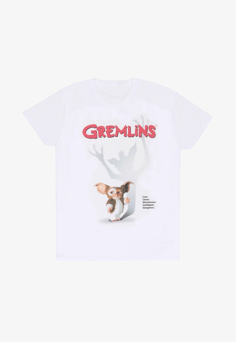 Bílé bavlněné tričko s grafikou postavy gremlina s výraznými ušima, textem a stínovým siluetovým efektem za ním.