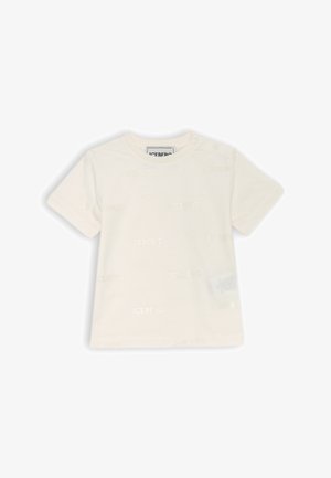 T-shirt a maniche corte color crema con logo "ICEBERG" in rilievo su tutta la superficie e un bottone a pressione sulla spalla per una facile vestibilità. Materiale in cotone morbido.