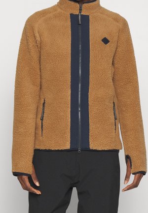 Brown fleece jacket with a navy vertical stripe, high collar, zip closure, and zippered side pockets. Features a diamond logo on the chest.