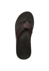 Infradito marroni con suola nera texturizzata. Cinturino in pelle con il logo "REEF", design con fascetta tra le dita e supporto per l'arco rialzato.