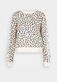 Kort sweatshirts i krämfärg med svart och brunt leopardmönster. Har långa ärmar och ribbade muddar, med vita ränder längs sidorna.