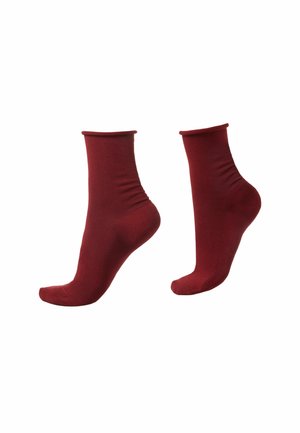 Burgundy ankle-length socks made of soft fabric, with a smooth texture and fitted design. Features a ribbed cuff and seamless toe closure.