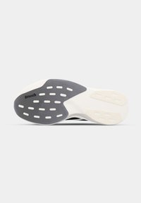 Sole of a shoe with white and grey rubber grip areas and cut-out slots, showing the Continental brand logo on the grey section.
