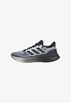 Scarpa da corsa nera e grigia con tomaia in rete, tre strisce bianche, suola ammortizzata e dettagli testurizzati sulla soletta.