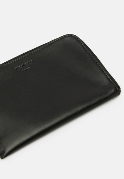 Black leather zip-around wallet with rounded corners and subtle embossed text on top left corner, displayed on white background.