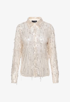 Crèmekleurig overhemd met knopen en franjes en metalen accenten. De gestructureerde stof heeft verticale lijnen en een klassieke kraag. Lange mouwen.