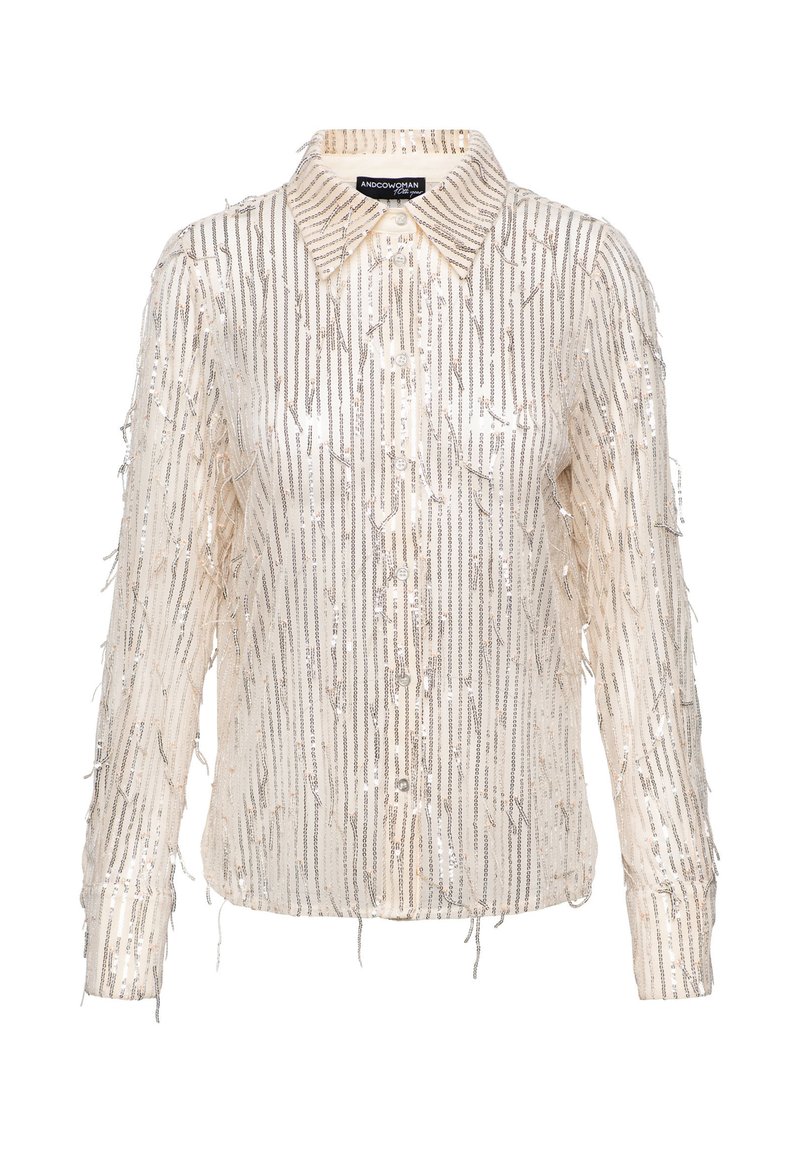 Crème overhemdd met verticale metallic franjes, een kraag en lange mouwen. Zachte textuur met glanzende accenten overal.