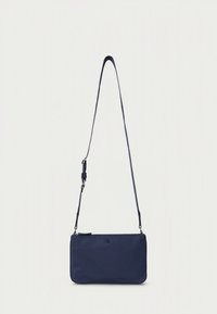 Navy blue crossbody bag made from smooth fabric. Features an adjustable strap and a subtle logo on the front. Rectangular shape, zipper closure.