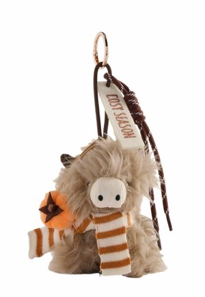 Keychain with a small fluffy Highland cow wearing an orange and white striped scarf and holding a small pumpkin with a star.