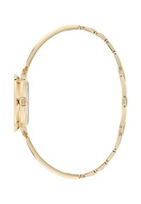 Plonas auksinis laikrodis su lygiu grandinėle ir apvaliu korpusu, parodytas šonu baltame fone.