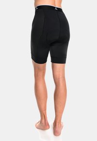 Pantalones cortos deportivos negros con un diseño de malla texturizada en los laterales, cinturilla ancha, corte ajustado y área de asiento acolchada para mayor comodidad.