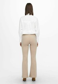 ONLY ONLFEVER FLARED PANTS - Leggings - Trousers - beige