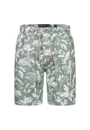 Gröna shorts i tyg med ett tropiskt vitt lövmönster, med dragsko i midjan och en knappstängning upptill.