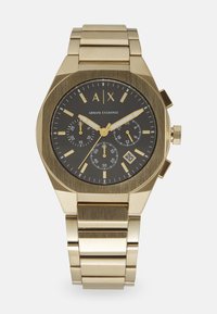 Goldfarbener Edelstahluhren mit einem runden schwarzen Zifferblatt, leuchtenden Markierungen, Chronographenfunktionen und einer Datumsanzeige um 6 Uhr.