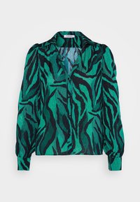 Blouse à manches longues boutonnée avec des rayures zébrées abstraites bleu sarcelle et noires, un col et des épaules légèrement bouffantes.