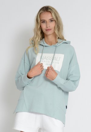 Light blue cotton hooded sweatshirt featuring a white logo print on the front, kangaroo pocket, and ribbed cuffs. Simple design with a relaxed fit.