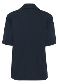 Camisa azul marino de manga corta con cuello clásico. Tejido suave y liso con un corte relajado y diseño de espalda recta. Detalles de costura mínimos.