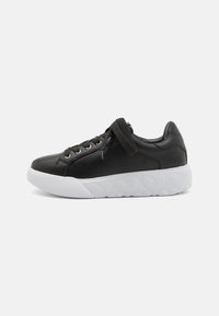 Black leather sneakers with a rounded white sole, featuring gold eyelets and black laces. Smooth texture and minimalist design.