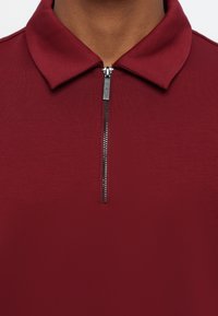 Michael Kors INTERLOCK ZIP  - Polo shirt - dark red