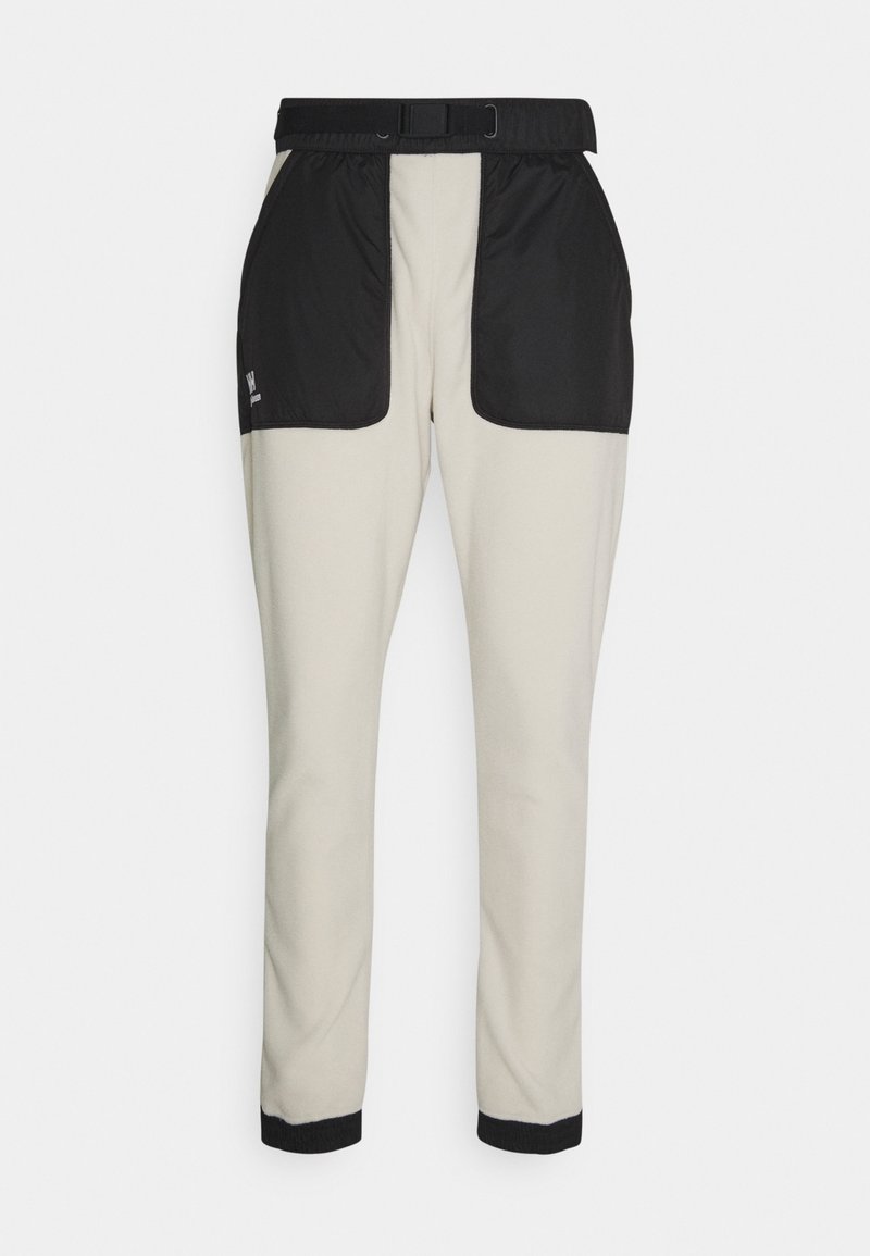 Hosen aus weichem Stoff in einem hellbeigen Farbton mit schwarzen Nylon-Einsätzen an den Hüften. Mit einem Bund mit einem Gürtel und gefitteten Bündchen.