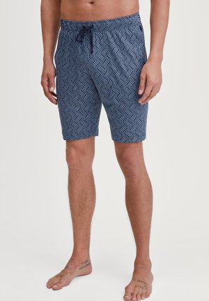 Marineblauwe zwembroek met een geometrisch patroon, verstelbare tailleband, boven de knie lengte, en een gladde katoenmix stof.