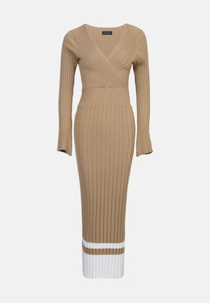 Ribbed knit dress in beige with a V-neck and long sleeves. Features a fitted bodice, a wide waistband, and a white striped hem.
