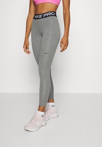 Nike Performance Leggingek - smoke grey heather/black