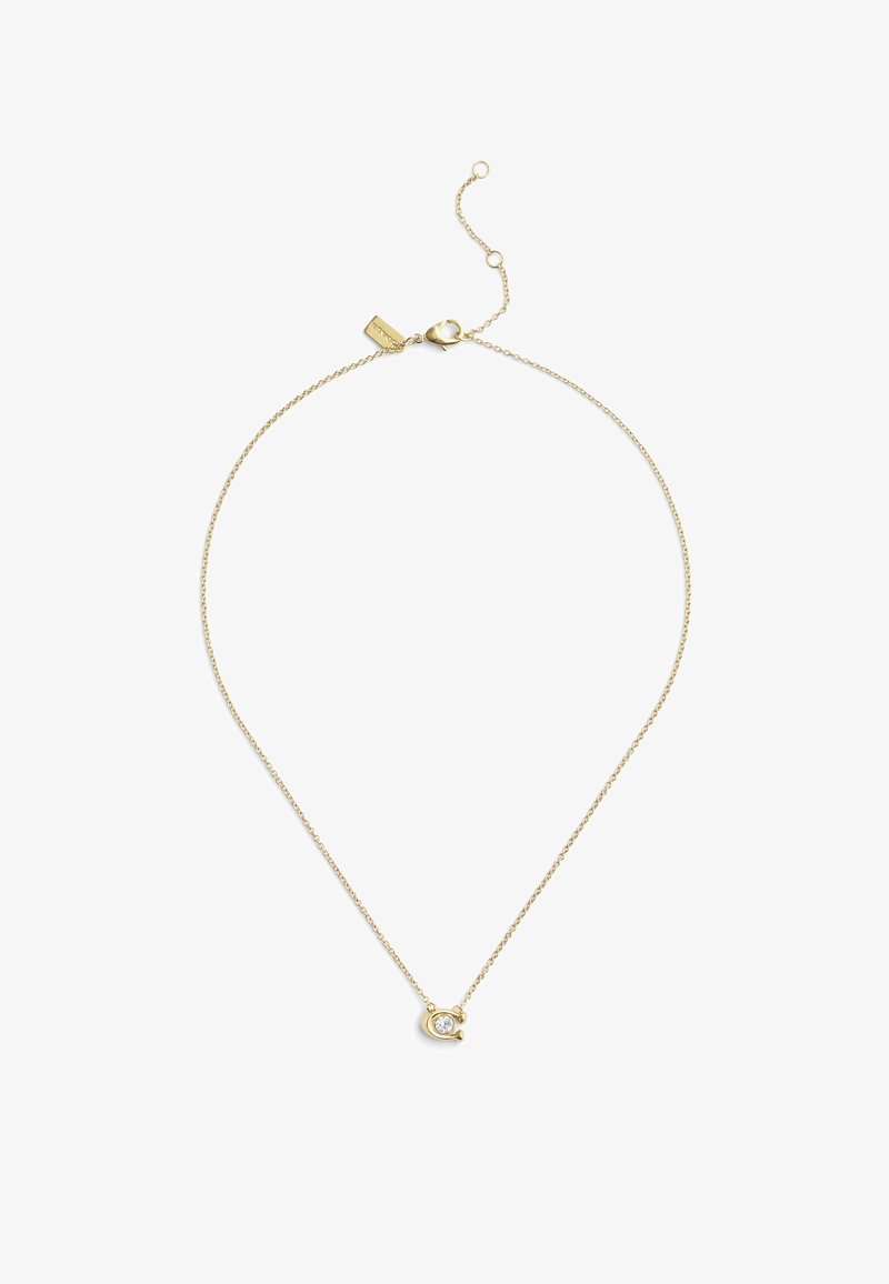 Collier en chaîne dorée présentant un design délicat avec un petit pendentif circulaire orné d'une pierre précieuse transparente. Fermoir ajustable pour varier la longueur.