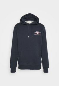 Marinblå hoodie i mjukt material, med en framficka i kängurustil, dragsnodd i huvan och en broderad logotyp på bröstet.