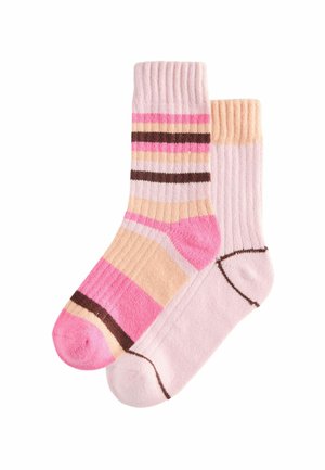 Two pairs of ribbed socks. One features stripes in pink, beige, and brown; the other is a solid light pink with brown accents.