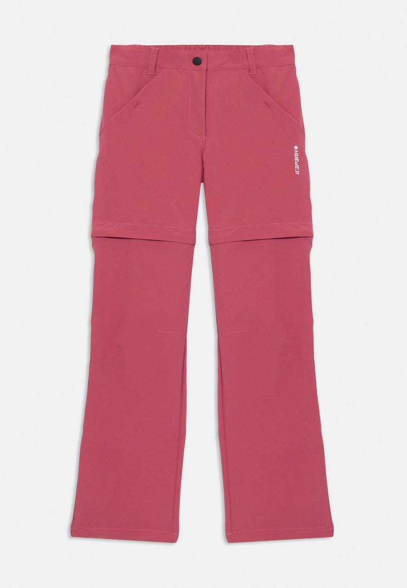 Pantalons softshell roses avec un design droit, comportant des poches latérales et des poignets ajustables pour plus de polyvalence. Le matériau semble léger et durable.