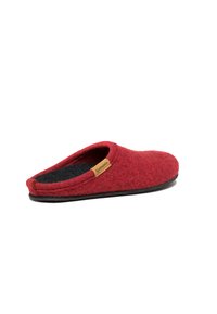 Red felt slipper with a black inner lining, open back design, and a small tag detailing the brand "Götzstein" on the side. Flat sole.