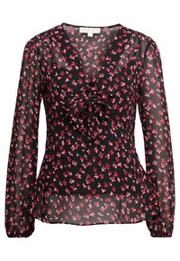 Blouse noire transparente à manches longues bouffantes, avec un profond col en V et un nœud à l'avant. Décorée de petits motifs floraux roses sur toute la surface.