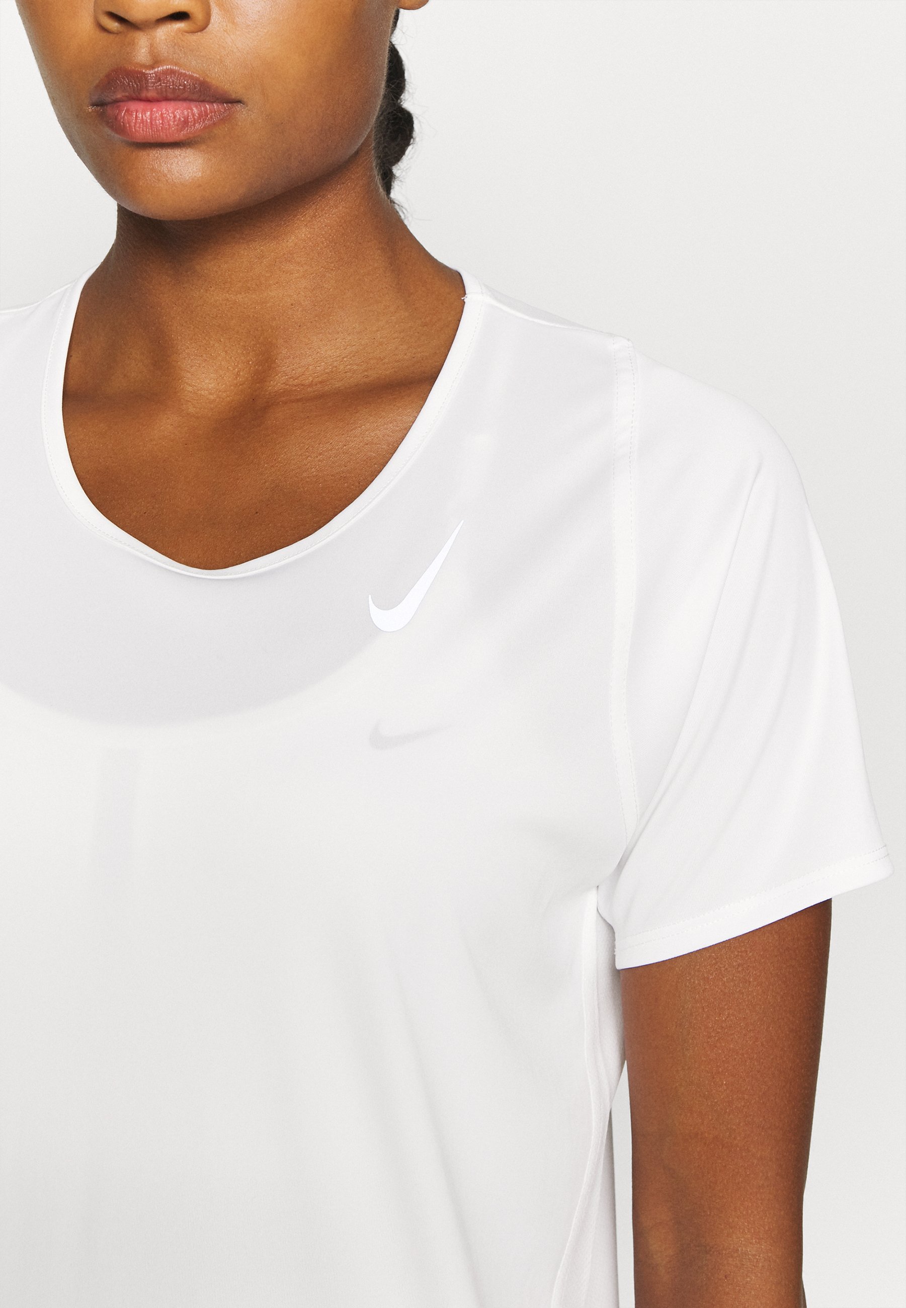 silver nike shirt