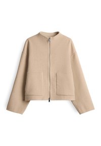 Giacca beige a metà vita con maniche lunghe, due tasche applicate frontali, scollatura rotonda e una cerniera frontale argentata a lunghezza totale.