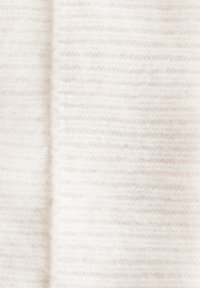 White knitted fabric with a soft, fuzzy texture and subtle horizontal stripes, creating a warm, layered appearance.