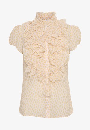 Blouse à manches courtes en tissu jaune doux avec un col haut froncé et un motif de cœurs sur toute la surface. Fermeture à boutons sur le devant.