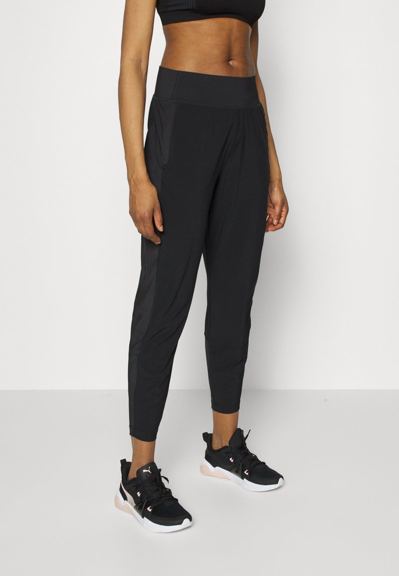 Athleta RUN WITH PANT Tracksuit bottoms black Zalando.ie