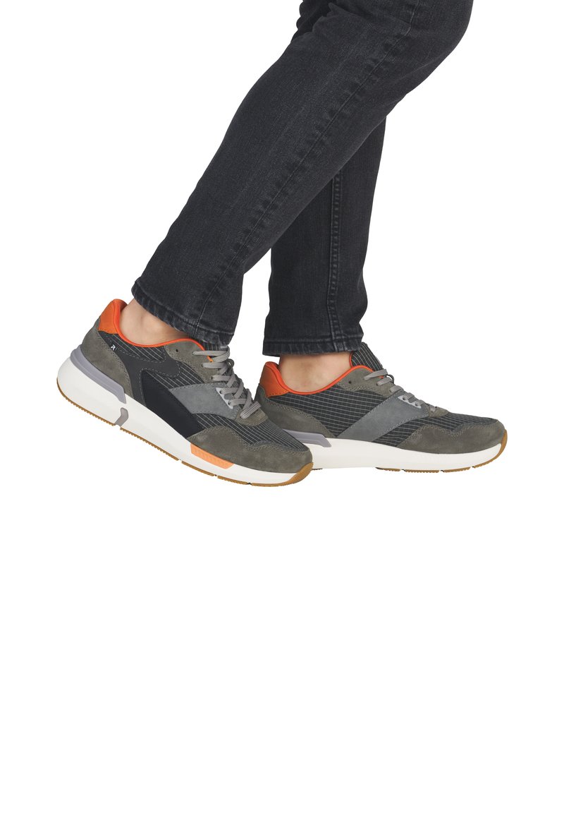 Sneakers featuring a mix of grey suede and mesh, with orange accents. Rounded toe, grey laces, and a white rubber sole with textured pattern.