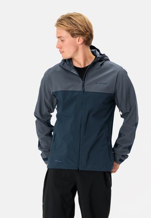 Giacca a zip di lunghezza intermedia in blu scuro e grigio, con cappuccio e due tasche laterali. Realizzata in materiale leggero e idrorepellente.
